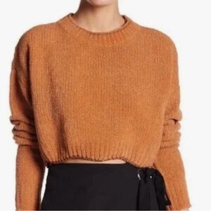 Burnt orange sweater.